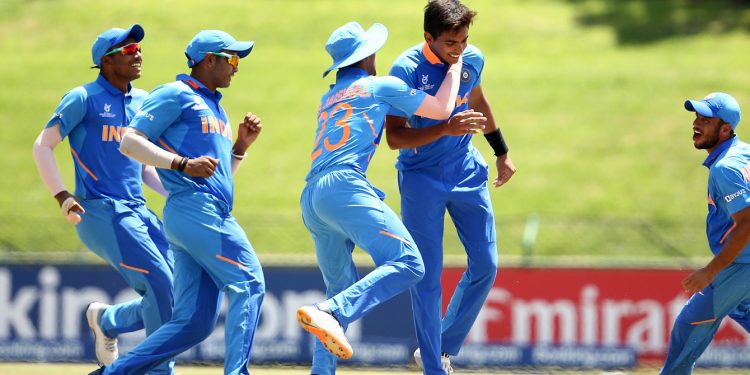 Kartik Tyagi celebrates with teammates after dismissing an Australian batsmen in the U-19 World Cup