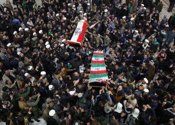 Mourners carry the coffins of Iran's Gen. Qassem Soleimani and Abu Mahdi al-Muhandis, deputy commander of Iran-backed militias at the Imam Ali shrine in Najaf, Iraq, Saturday, Jan. 4, 2020. Iran has vowed "harsh retaliation" for the U.S. airstrike near Baghdad's airport that killed Tehran's top general and the architect of its interventions across the Middle East, as tensions soared in the wake of the targeted killing. (AP Photo/Anmar Khalil)