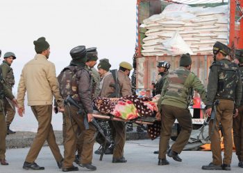 Body of one of the slain terrorists being carried away by the security personnel