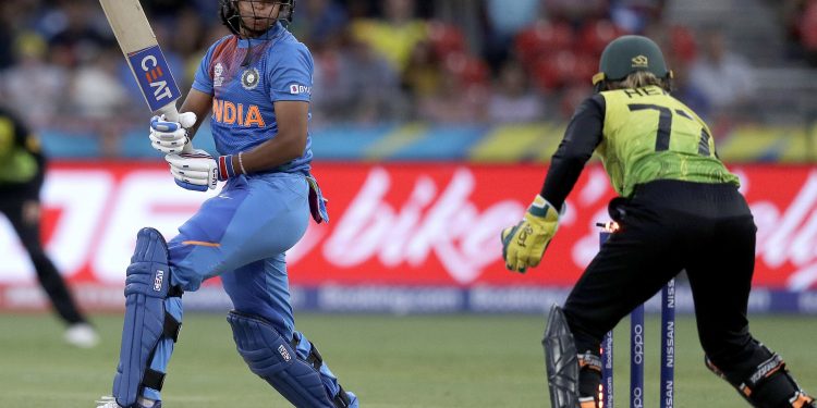 Sydney: India's Harmanpreet Kaur, left, turns to see she is stumped accidentally by Australia's Alyssa Healy during the first game of the Women's T20 Cricket World Cup in Sydney, Friday, Feb. 21, 2020.