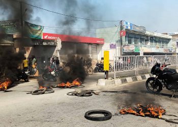 Road block at the place where the 6-year-old fell off the auto-rickshaw and died