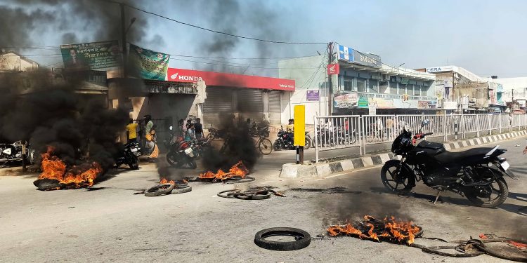 Road block at the place where the 6-year-old fell off the auto-rickshaw and died