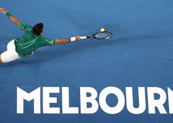 Novak Djokovic stretches out to hit a forehand