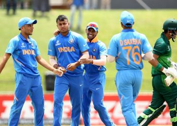 Pacer Sushant Mishra celebrates with teammates after dismissing a Pakistani batsman