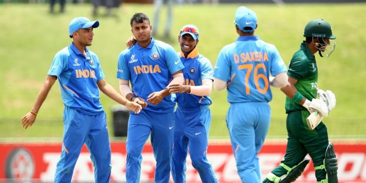 Pacer Sushant Mishra celebrates with teammates after dismissing a Pakistani batsman