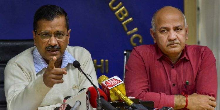 Delhi Chief Minister Arvind Kejriwal and his deputy Manish Sisodia talk to the media in New Delhi, Thursday