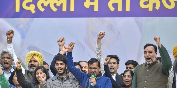 Arvind Kejriwal with family members and AAP leaders celebrate the party's victory Tuesday