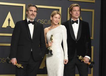 Joaquin Phoenix, winner of the Best Actor award, Renee Zellweger, winner of the Best Actress award and Brad Pitt, winner of the Best Supporting Actor pose in the press room at the Oscars