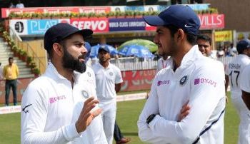 Shubman Gill (R) with captain Virat Kohli
