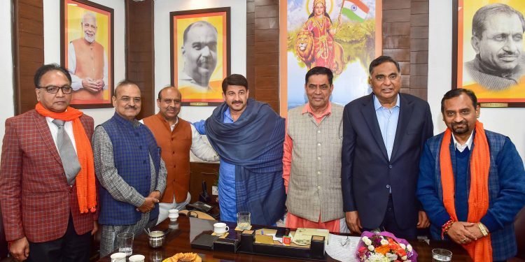 Manoj Tiwari (C) and other leaders of the BJP's Delhi unit during a meeting Wednesday