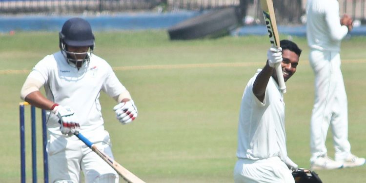 Debashis Samantray acknowledges the applause after reaching his hundred against Jharkhand