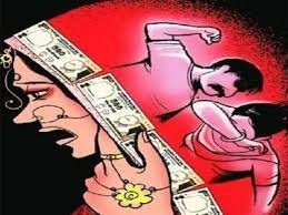 Woman set ablaze by in-laws over dowry, dies