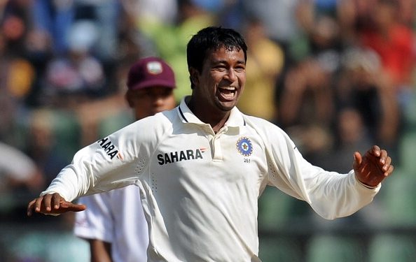 Indian bowler Pragyan Ojha celebrates after taking wicket of West Indies batsman Marlon Samuels during fifth day play of the third Test cricket match between India and the West Indies at The Wankhede stadium in Mumbai on November 26, 2011. AFP PHOTO/Punit PARANJPE (Photo credit should read PUNIT PARANJPE/AFP/Getty Images)