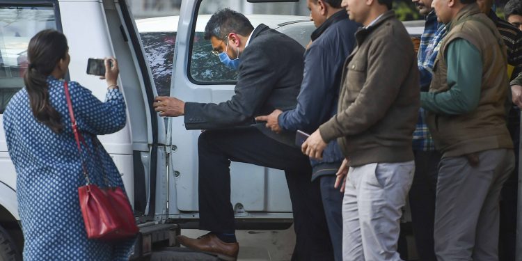 Bookie Sanjeev Chawla (wearing face mask) being escorted by police officials