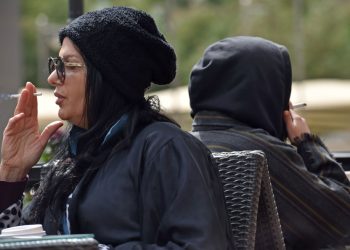 Women smoke publicly at a coffee shop in north Riyadh on January 25, 2020. - Like Western feminists of the early 20th century, in an era of social change in Saudi Arabia some women are embracing cigarettes, shisha pipes or vaping as a symbol of emancipation. The sight of women lighting up in public has become much more common in recent months, an unthinkable prospect before the introduction of sweeping reforms in the ultra-conservative kingdom. Women are now allowed to take the wheel of cars, go to stadiums to watch sports and concerts, and obtain passports without the approval of a male guardian (Photo by FAYEZ NURELDINE / AFP)