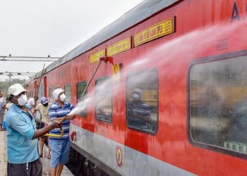 Kolkata: Railway workers spray disinfectant on Howrah-New Delhi Rajdhani Express train in the wake of coronavirus pandemic, at a railway yard in Kolkata, Monday, March 16, 2020. (PTI Photo/Swapan Mahapatra)(PTI16-03-2020_000096B)