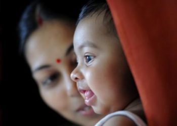 Baby girl with mother smiling