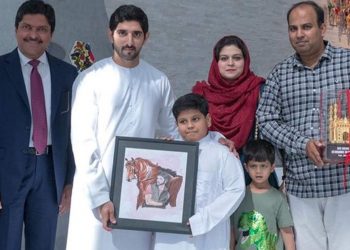 Sheikh Hamdan with Abdullah 9holding picture) and his family