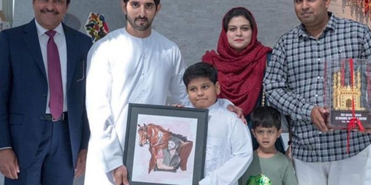 Sheikh Hamdan with Abdullah 9holding picture) and his family