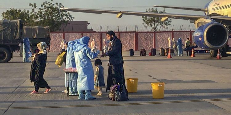 TWITTER IMAGE POSTED BY @PRODefRjsthn ON SUNDAY, MARCH 29, 2020, Jodhpur: Medics screen passengers, who were airlifted from Iran, before being sent for a mandatory isolation period to an Indian Army Wellness Facility in Jodhpur. (PTI Photo)