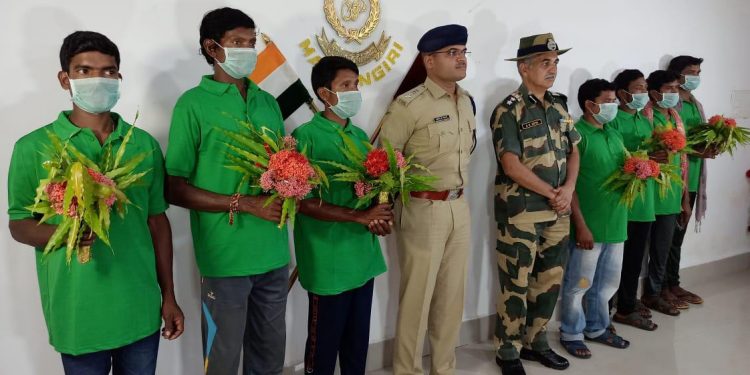 Malkangiri SP Rishikesh D Khilari and other officials with the seven Maoists who surrendered