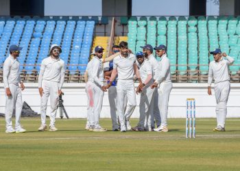 Saurashtra cricketers celebrate the dismissal of a Bengal batsman