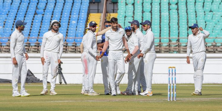 Saurashtra cricketers celebrate the dismissal of a Bengal batsman