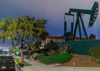 Pump jacks draw crude oil from the Long Beach Oil Field near homes in Signal Hill, California, on March 9, 2020. - Global stocks and oil prices rebounded on March 10, 2020 on hopes of US economic stimulus efforts as the coronavirus rages, one day after suffering their biggest losses in more than a decade. Trading is exceptionally volatile as investors attempt to get a grip on a rapidly changing news flow, with positive reports of progress in China on the virus clashing with a Saudi decision to increase oil output in an already over-supplied market. (Photo by DAVID MCNEW / AFP) (Photo by DAVID MCNEW/AFP via Getty Images)