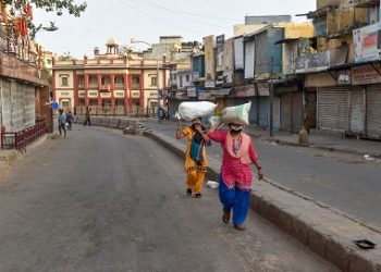 New Delhi: Women walk on a deserted road at Naya Bazar during the nationwide lockdown, imposed in wake of the coronavirus pandemic, in New Delhi, Tuesday, April 7, 2020. (PTI Photo/Manvender Vashist)
(PTI07-04-2020_000251B)