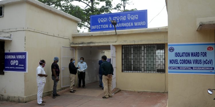 Doctors and medical staffs are working overtime at Corona virus ODD at Capital Hospital in Bhubaneswar on Sunday during 48hours complete shutdown in Bhubaneswar on Sunday.