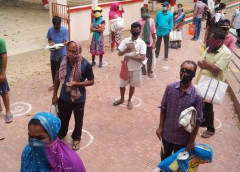 Social distancing in front of a shop in Bhubaneswar