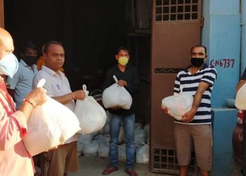 Dry ration being distributed by members of the Odia Samaj in New delhi