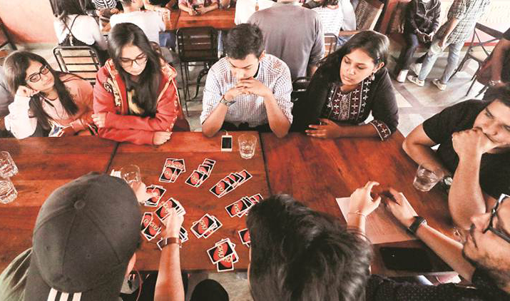 familes playing indor games-cards- together (2)