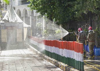 Firefighters spray disinfectants at a locality near Nizamuddin mosque, Thursday