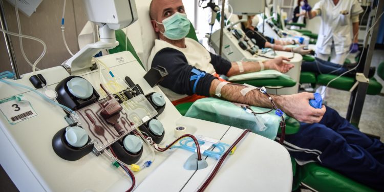 Mandatory Credit: Photo by MATTEO CORNER/EPA-EFE/Shutterstock (10604430c)
A patient recovered from COVID-19 coronavirus undergoes to a plasma sampling that will be used for transfusions to positive patients at the Policlinico San Matteo hospital in Pavia, Italy, 06 April 2020. Countries around the world are taking increased measures to stem the widespread of the SARS-CoV-2 coronavirus that causes the Covid-19 disease.
Coronavirus in Italy, Pavia - 06 Apr 2020