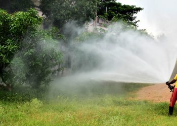 Fire brigade personnel conduct a mock drill at a fire station at Kalpana Square in Bhubaneswar, Wednesday, to deal with possible locust attacks in state