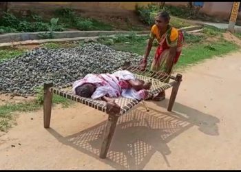 Woman drags cot with ailing centenarian mother on to the bank for Rs.1500