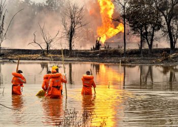 Tinsukia: NDRF personnel carry out search and rescue operations after two firemen of Oil India Limited went missing since an oil well at the company’s Baghjan oilfield exploded, in Assam’s Tinsukia district, Wednesday, June 10, 2020. (PTI Photo)