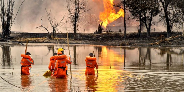Tinsukia: NDRF personnel carry out search and rescue operations after two firemen of Oil India Limited went missing since an oil well at the company’s Baghjan oilfield exploded, in Assam’s Tinsukia district, Wednesday, June 10, 2020. (PTI Photo)