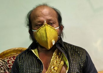 Alok Mohanty flaunting his gold-studded mask