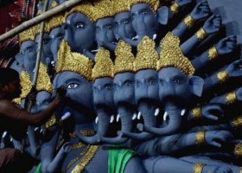 File photo of an artist giving final touches to an idol of Lord Ganesh in Bhubaneswar