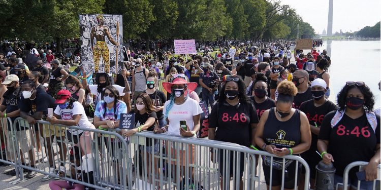 Washington : People attend the March on Washington, Friday, Aug. 28, 2020, at the Lincoln Memorial in Washington, on the 57th anniversary of the Rev. Martin Luther King Jr.'s "I Have A Dream" speech. AP/PTI(AP28-08-2020_000208B)