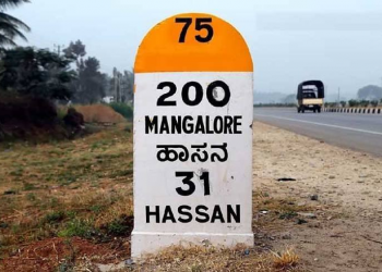 Why do roads in India have colored milestones?