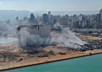An aerial view shows the massive damage done to Beirut Port's grain silos (centre) and the area around it August 5, 2020, a day after a mega-blast tore through the harbor in the heart of the Lebanese capital. (Photo courtesy: AFP via asiatimes.com)