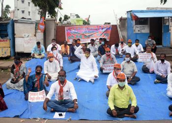 BJP activists stage a dharna in front of Bagala Dharmashala in Puri