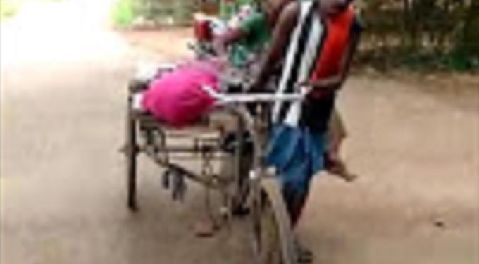 Deprived of hospital help family members carry deceased’s body on trolley