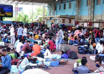 Throwing COVID-19 guidelines to winds, travellers wait at Bhubaneswar railway station, Monday