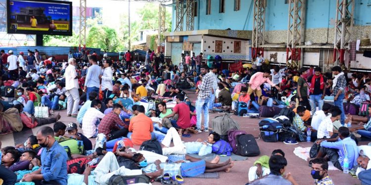 Throwing COVID-19 guidelines to winds, travellers wait at Bhubaneswar railway station, Monday