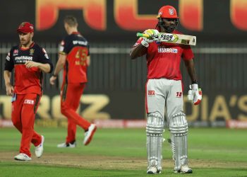 Chris Gayle shows off 'The Boss' sticker on his bat after reaching 50 against RCB in Sharjah, Thursday