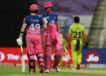 Jos Buttler (R) and Steve Smith congratulate each other after completing 50 runs of partnership against CSK in Abu Dhabi, Monday